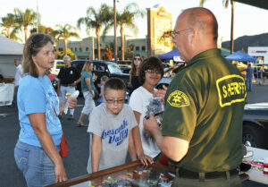 officer talking to people