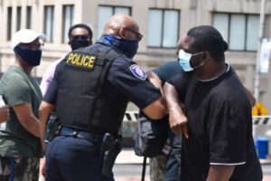 police officer hugging citizen