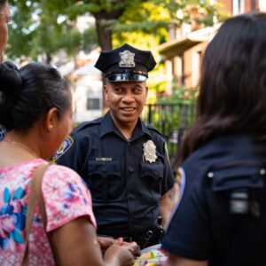 police officer talking with community members