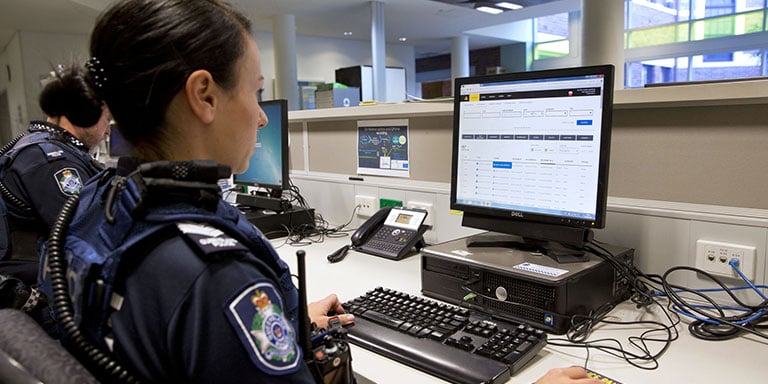 police officer on computer gov forms